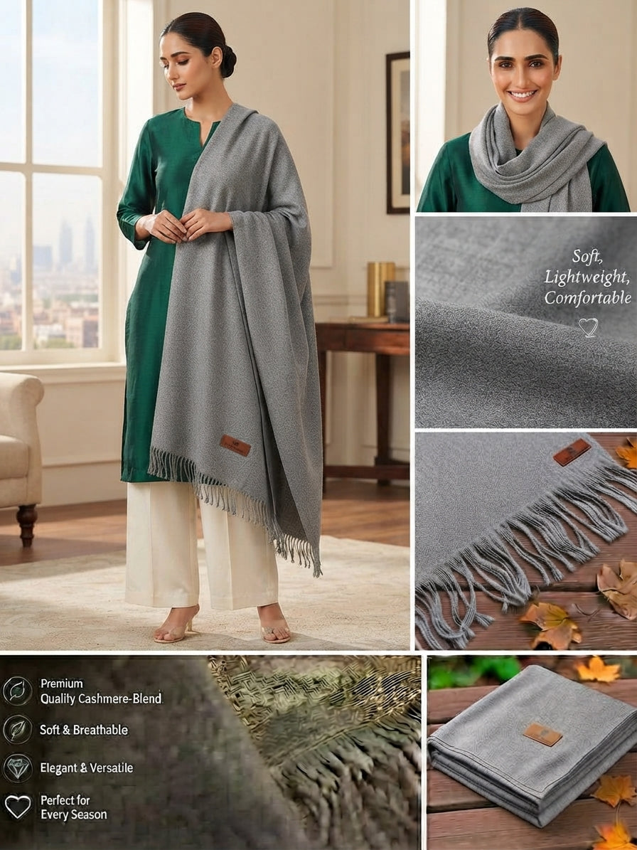 A gray cashmere shawl with fringe is shown worn by a woman in a green kurta and cream pants, alongside close-up detail shots of the fabric texture and a folded version with a small brown brand patch. Text on the image highlights soft, lightweight comfort and premium quality.