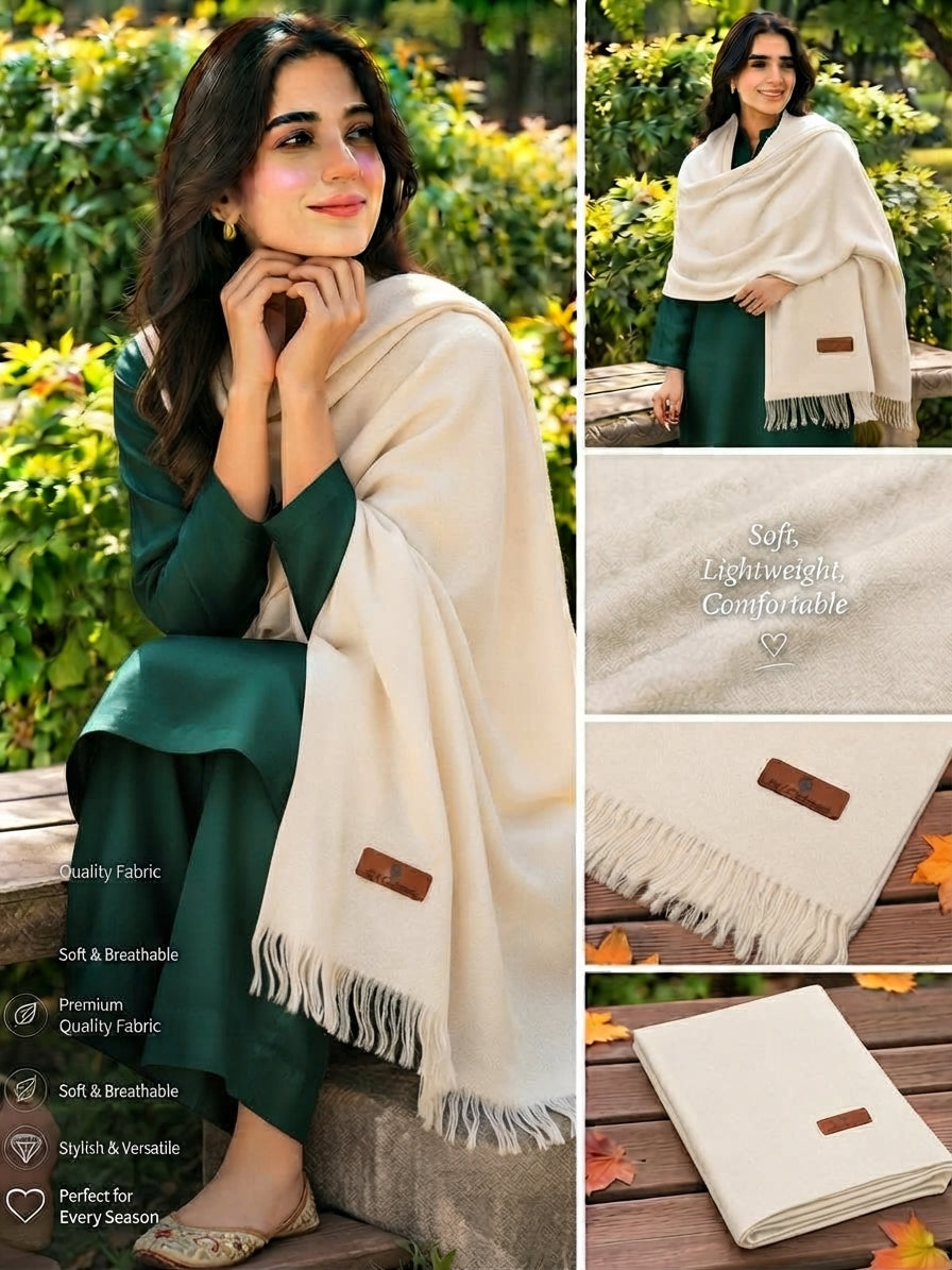 A cream-colored lightweight shawl with fringe and a small brown leather patch, shown worn by a woman in a green outfit in an outdoor garden setting, alongside close-up fabric texture shots and a folded view.